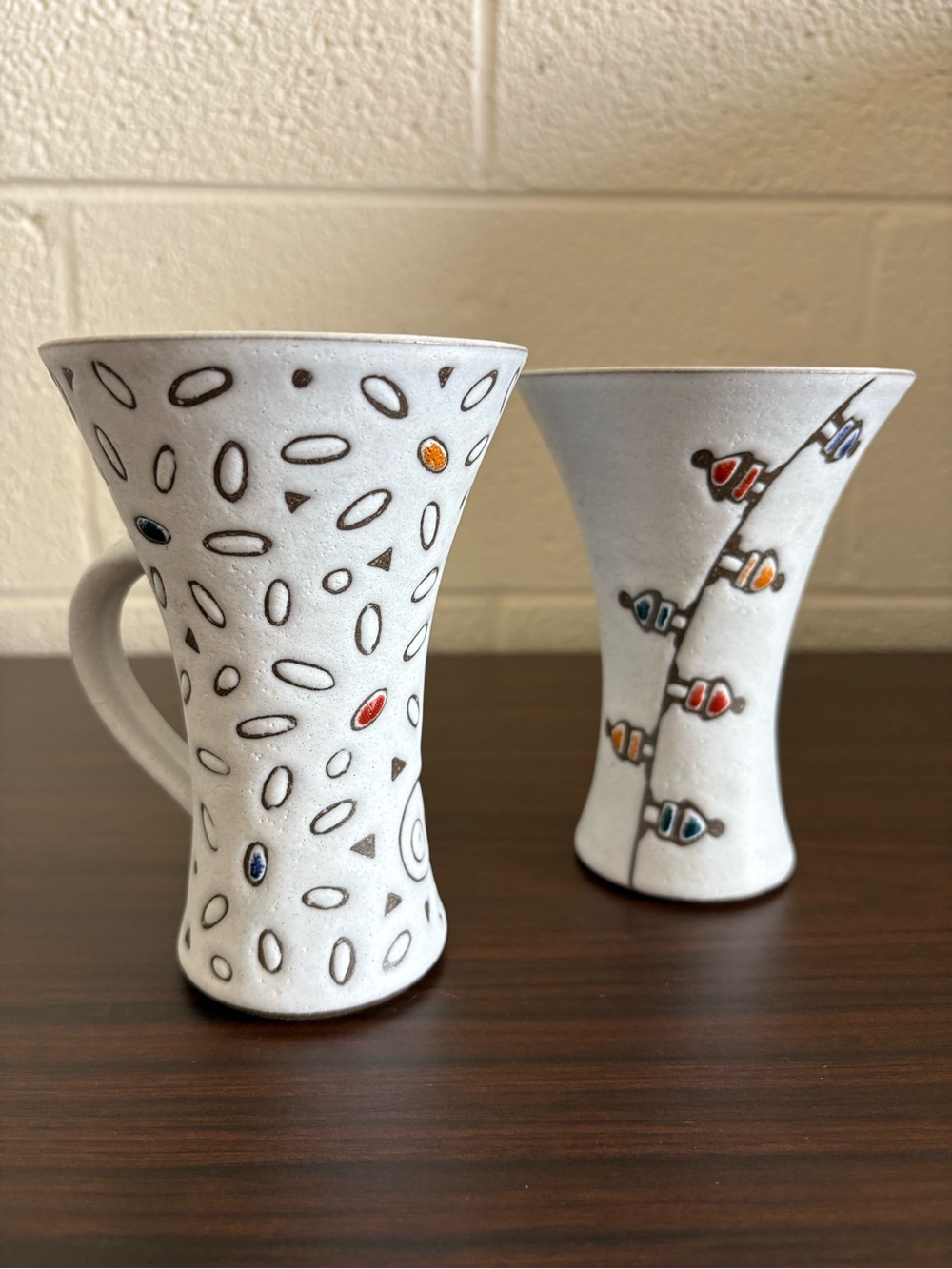Antique Handcrafted White Ceramic Art Mugs with Colorful Accents